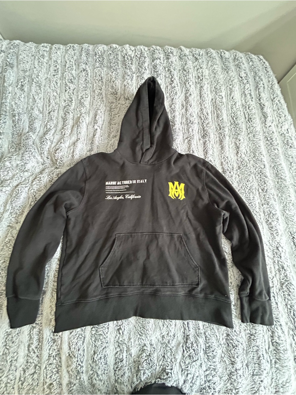Black Hoodie with Yellow Logo Graphic